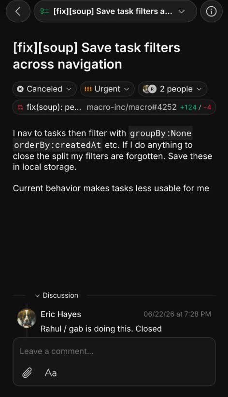 Macro task detail with a linked GitHub pull request pill, status, assignees and discussion thread